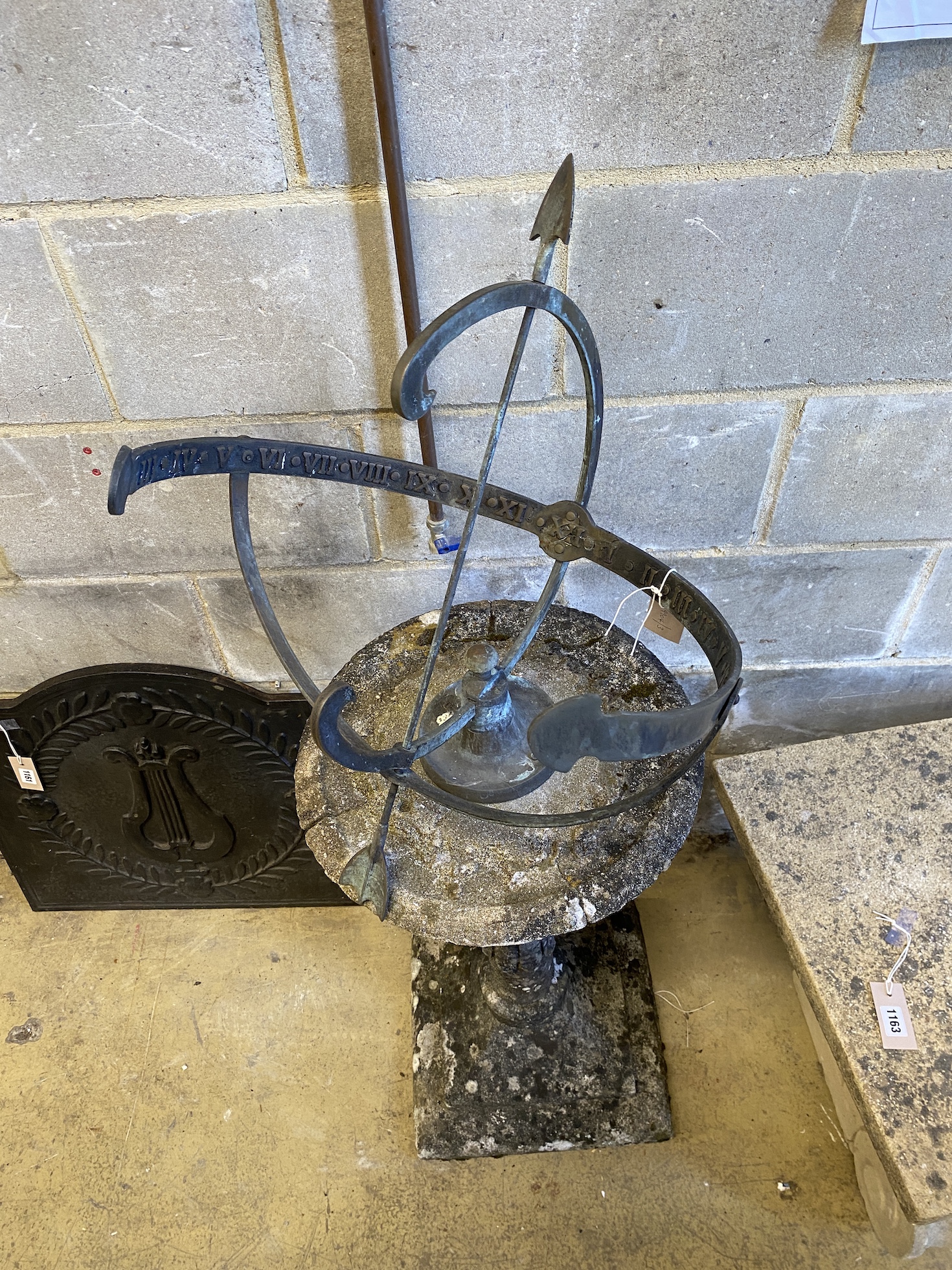 A cast metal and reconstituted stone orb sundial, height 125cm